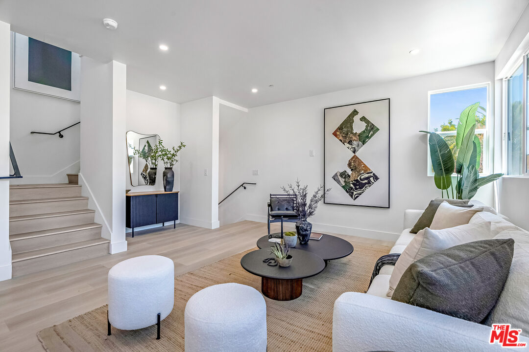 5832 David Avenue, Unit 1 Los Angeles, CA 90034 - Photo 11 of 44 a living room with furniture and wooden floor