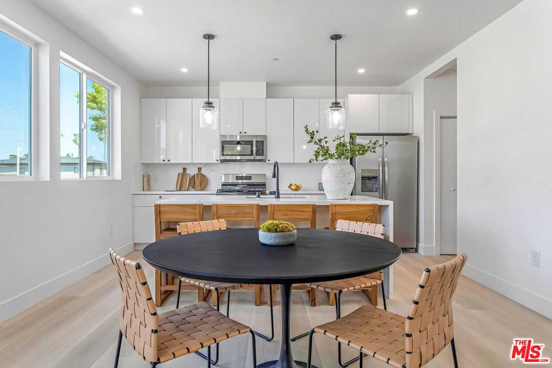 5832 David Avenue, Unit 1 Los Angeles, CA 90034 - Photo 12 of 44 a view of a dining room with furniture and window