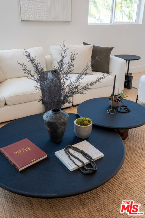 5832 David Avenue, Unit 1 Los Angeles, CA 90034 - Photo 15 of 44 a table with a couch and a potted plant