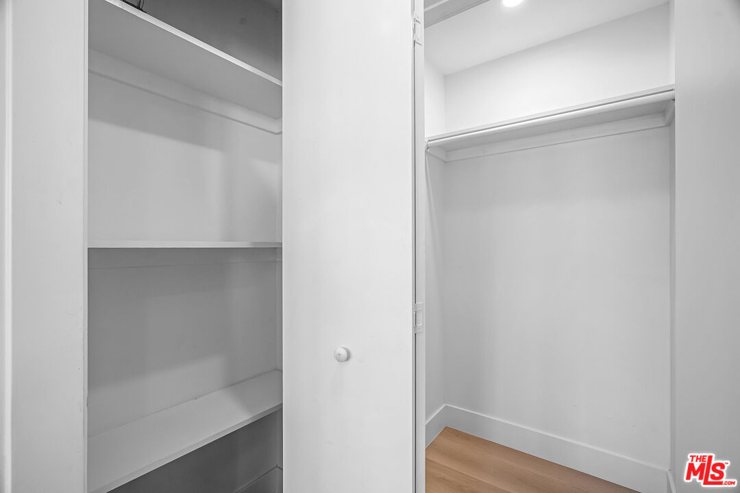 5832 David Avenue, Unit 1 Los Angeles, CA 90034 - Photo 19 of 44 a bathroom with a glass shower door