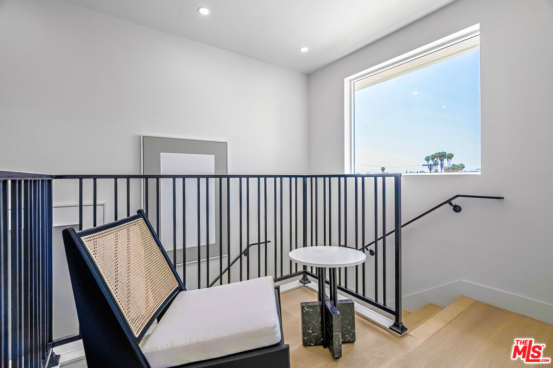 5832 David Avenue, Unit 1 Los Angeles, CA 90034 - Photo 21 of 44 a view of a hallway with furniture and stairs