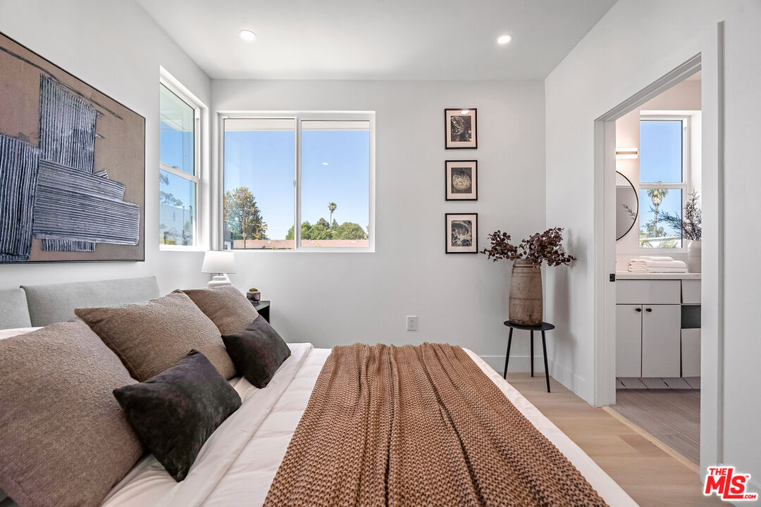 5832 David Avenue, Unit 1 Los Angeles, CA 90034 - Photo 24 of 44 a bed room with a bed and a window