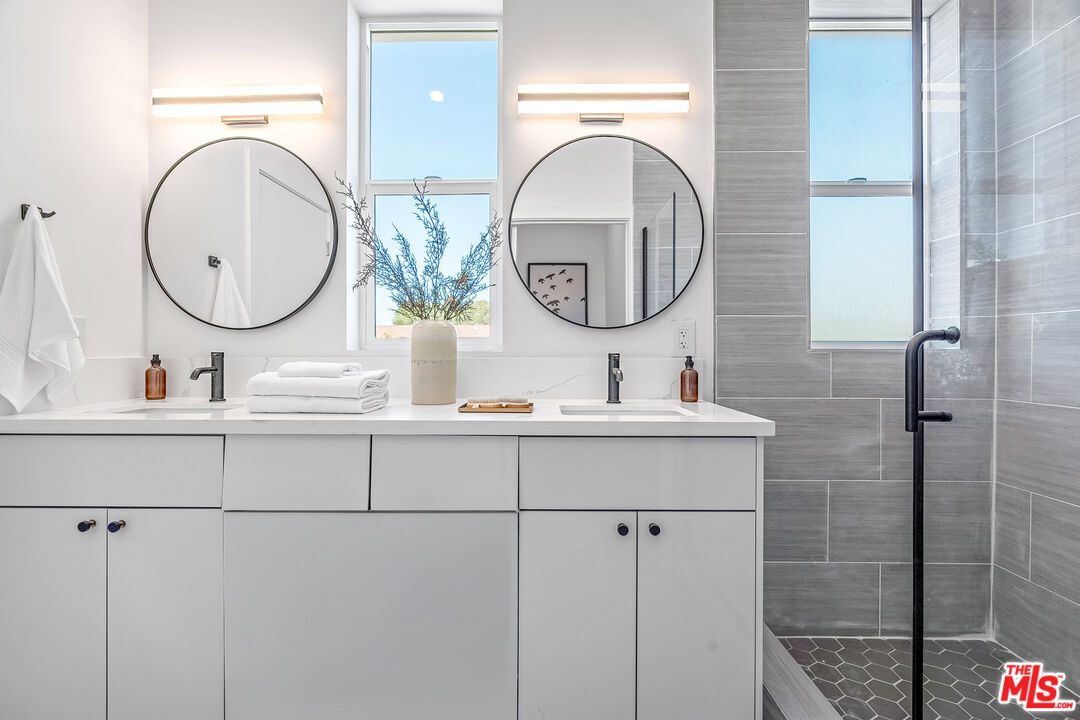 5832 David Avenue, Unit 1 Los Angeles, CA 90034 - Photo 26 of 44 a bathroom with a sink and a mirror