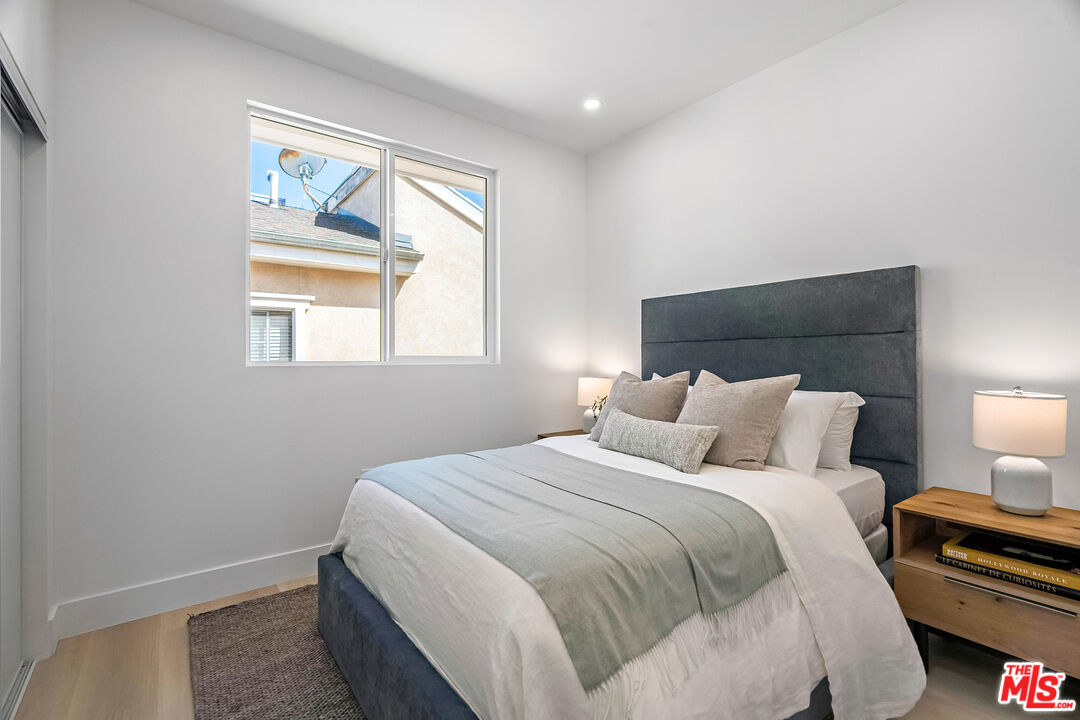 5832 David Avenue, Unit 1 Los Angeles, CA 90034 - Photo 28 of 44 a bedroom with a bed and a window