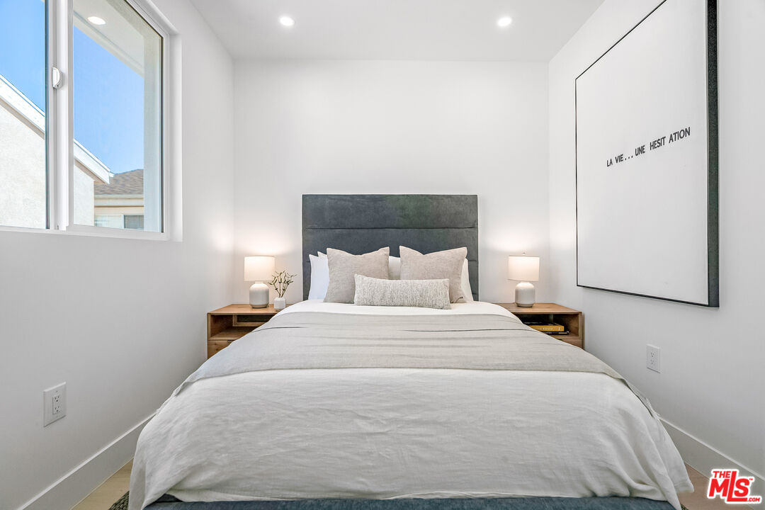 5832 David Avenue, Unit 1 Los Angeles, CA 90034 - Photo 29 of 44 a bedroom with a bed and a window