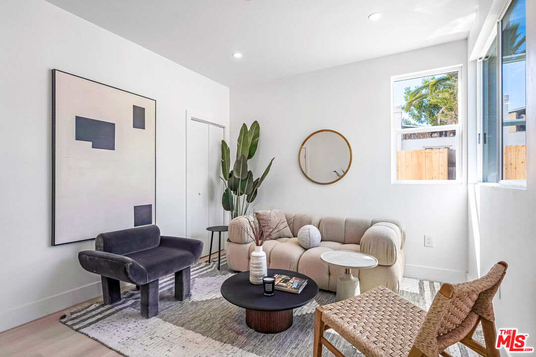 5832 David Avenue, Unit 1 Los Angeles, CA 90034 - Photo 6 of 44 a living room with furniture and a potted plant