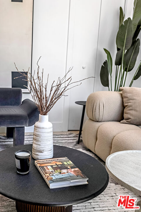 5832 David Avenue, Unit 1 Los Angeles, CA 90034 - Photo 7 of 44 a living room with furniture and a potted plant