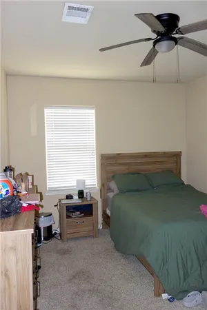 a bathroom with a granite countertop sink a toilet and bathtub