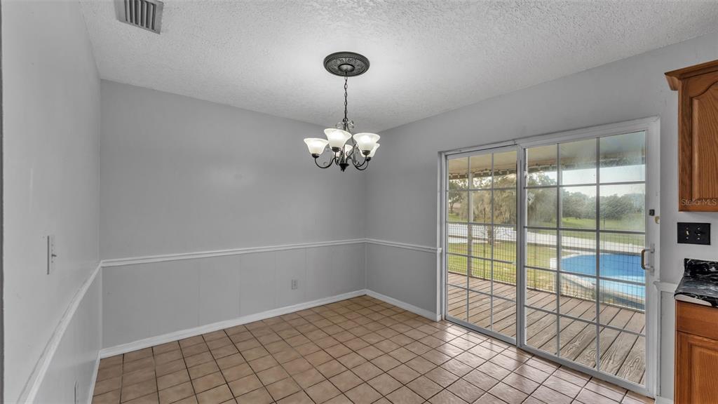 610 Frederick Avenue Dundee, FL 33838 - Photo 13 of 34 a view of a livingroom with a chandelier fan