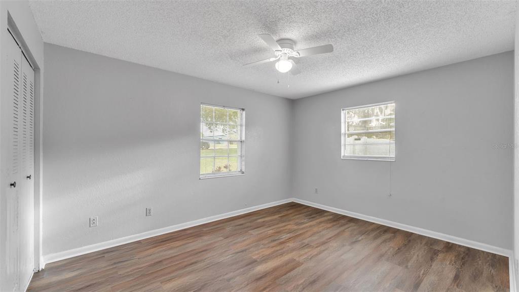 610 Frederick Avenue Dundee, FL 33838 - Photo 28 of 34 wooden floor in an empty room with a window