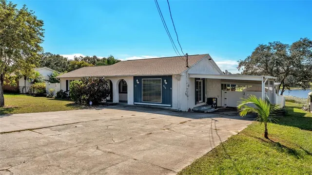 a front view of house with yard outdoor seating and green space