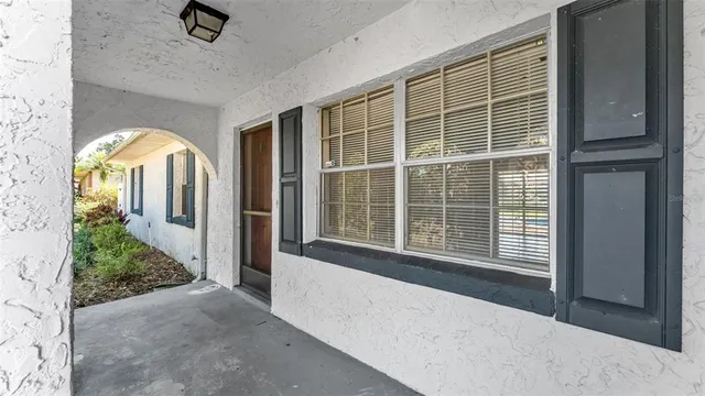 a front view of a house with a large window