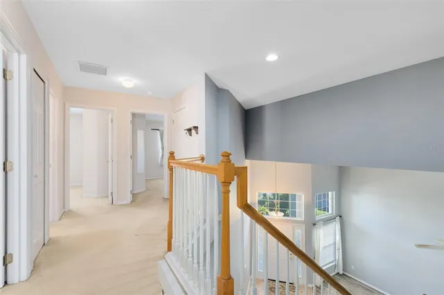 a view of a hallway with windows