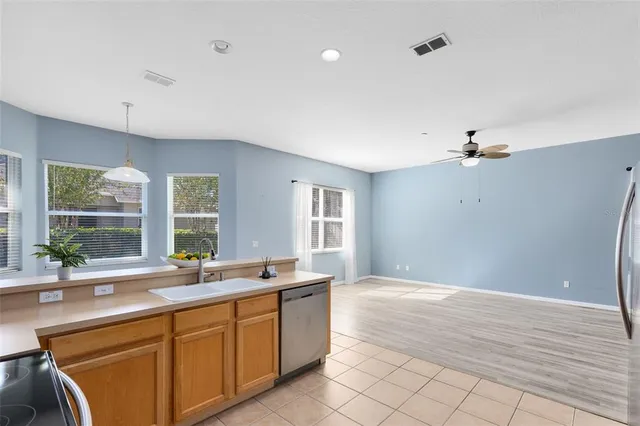 a spacious bathroom with a sink double vanity and a large mirror