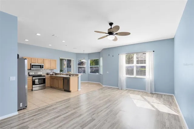 a view of kitchen with sink microwave and stove