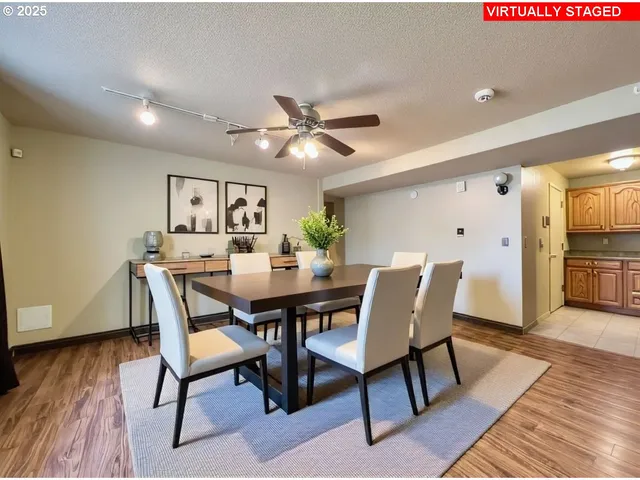 a view of a dining room with furniture and wooden floor