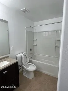 a bathroom with a granite countertop toilet a sink and bathtub