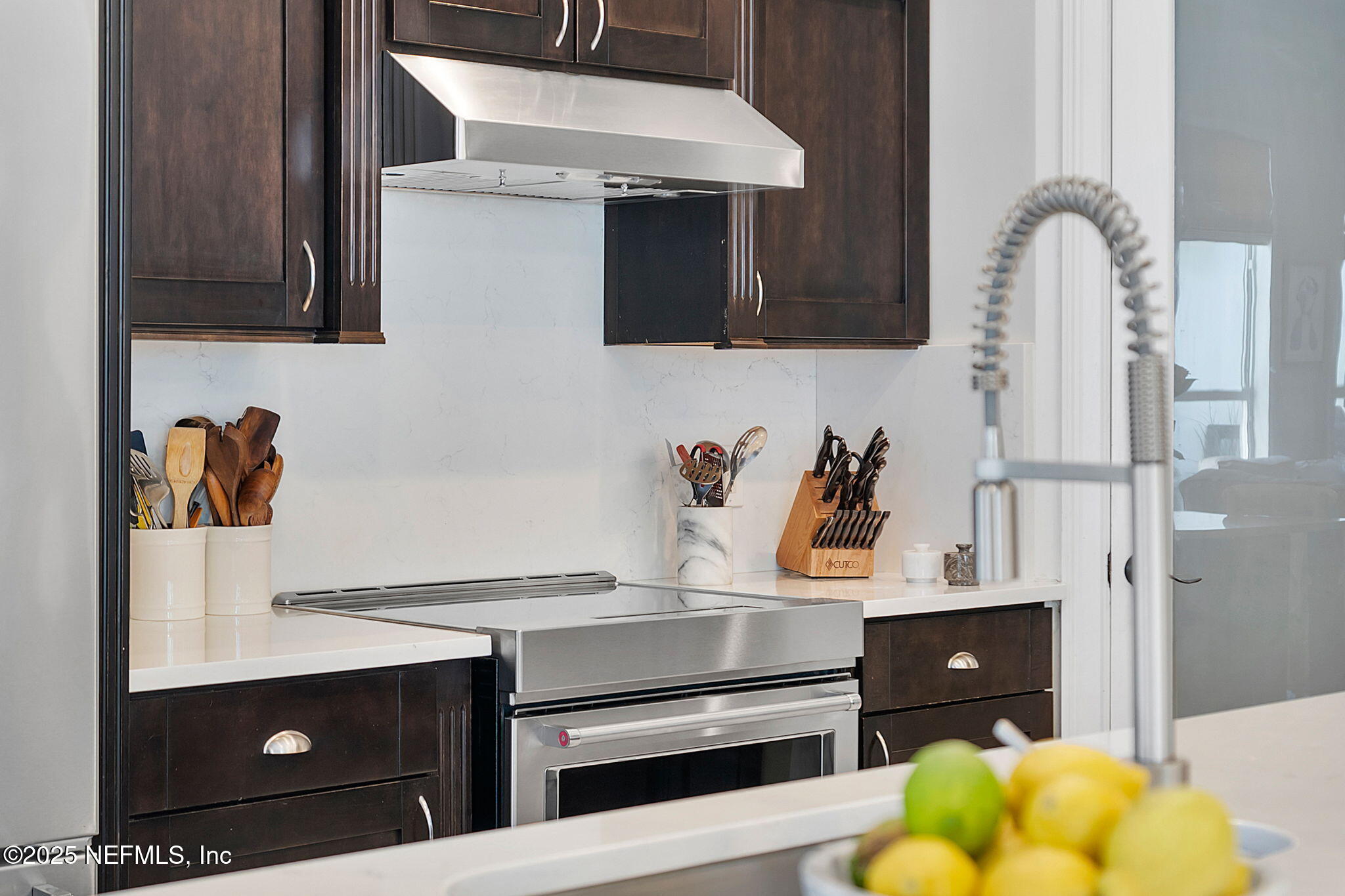 139 Foxcraft Street St. Augustine, FL 32092 - Photo 23 of 93 a kitchen with stainless steel appliances granite countertop a stove and a microwave