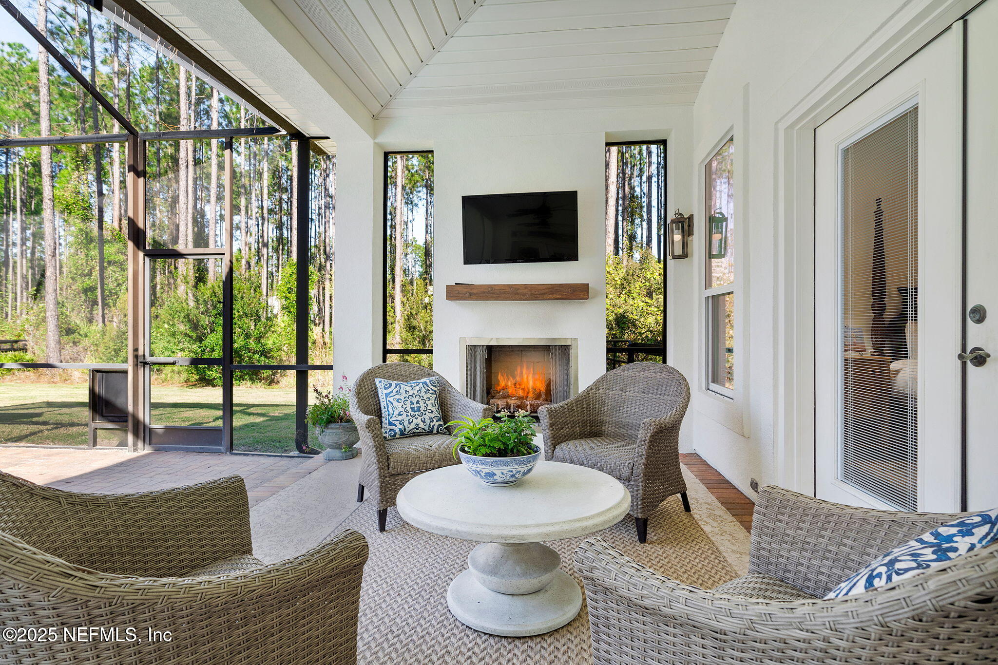 139 Foxcraft Street St. Augustine, FL 32092 - Photo 30 of 93 a living room with fireplace furniture and a floor to ceiling window