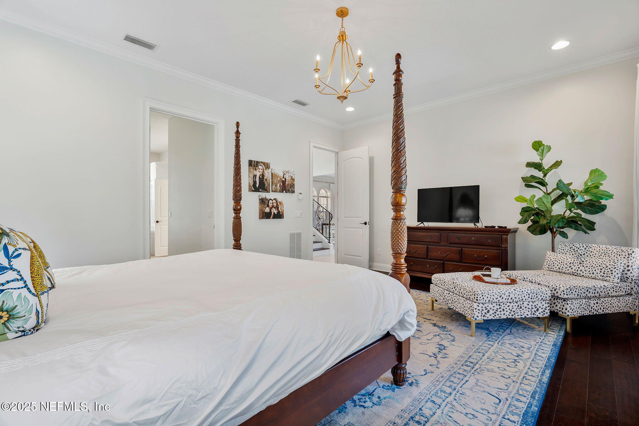 139 Foxcraft Street St. Augustine, FL 32092 - Photo 42 of 93 a bedroom with a bed a flat screen tv and a couch