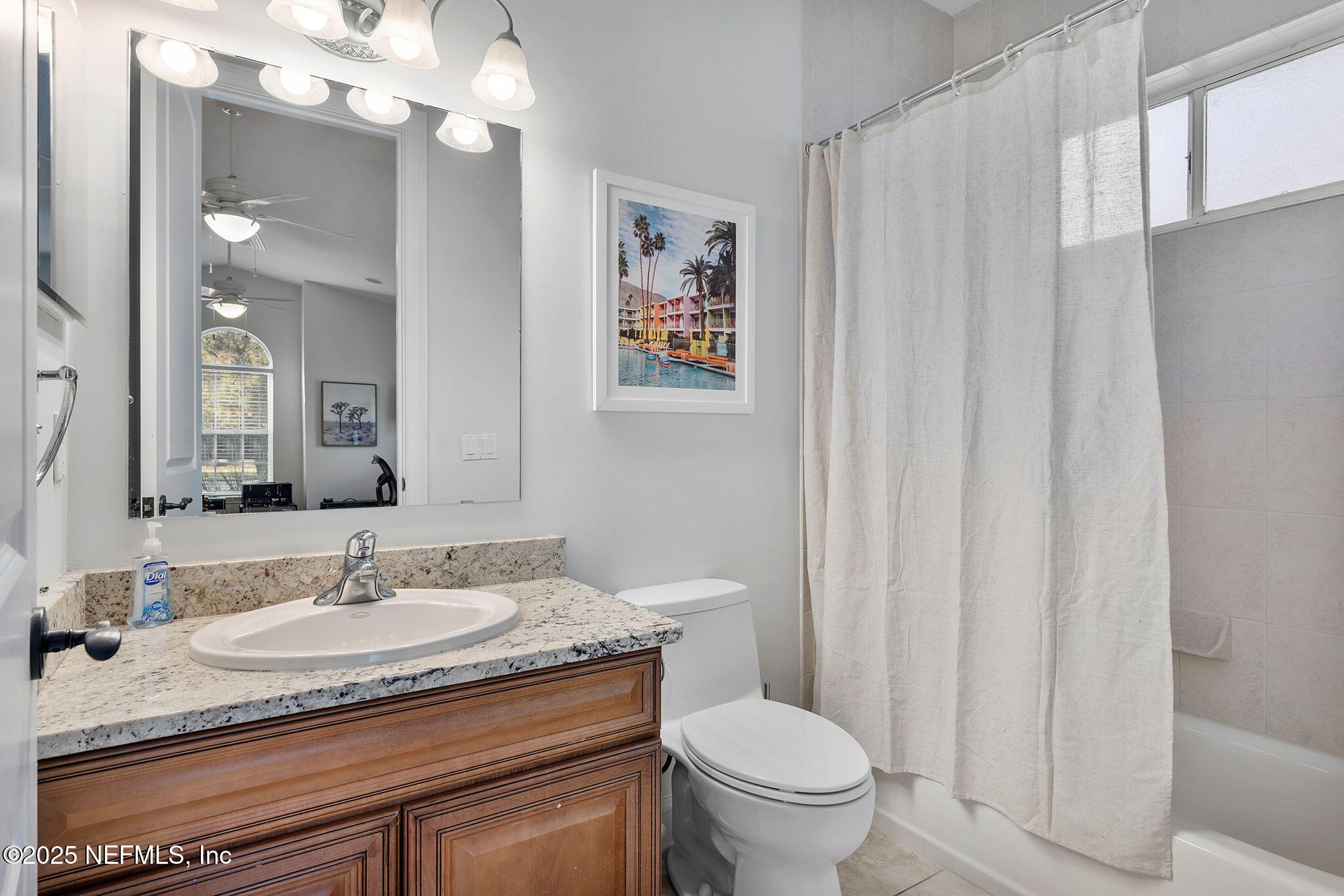 139 Foxcraft Street St. Augustine, FL 32092 - Photo 67 of 93 a bathroom with a granite countertop sink a toilet and a mirror