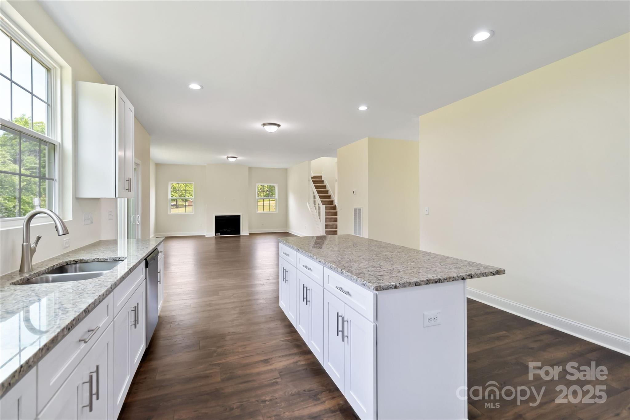 1034 Heath Helms Road Monroe, NC 28110 - Photo 14 of 30 a bathroom with a granite countertop sink and a large mirror