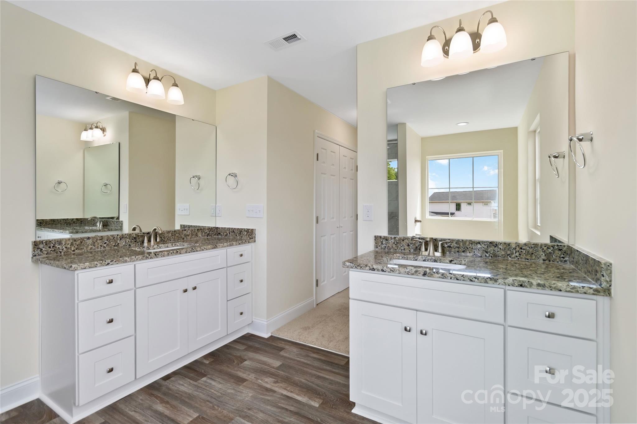 1034 Heath Helms Road Monroe, NC 28110 - Photo 19 of 30 a bathroom with a granite countertop sink mirror and a