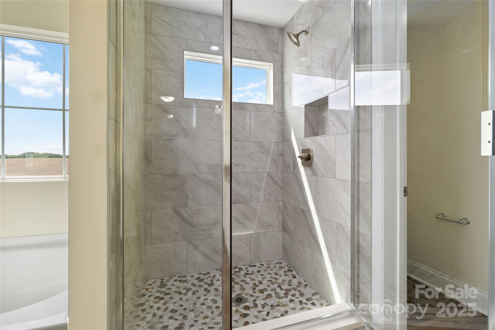 1034 Heath Helms Road Monroe, NC 28110 - Photo 20 of 30 a bathroom with a shower