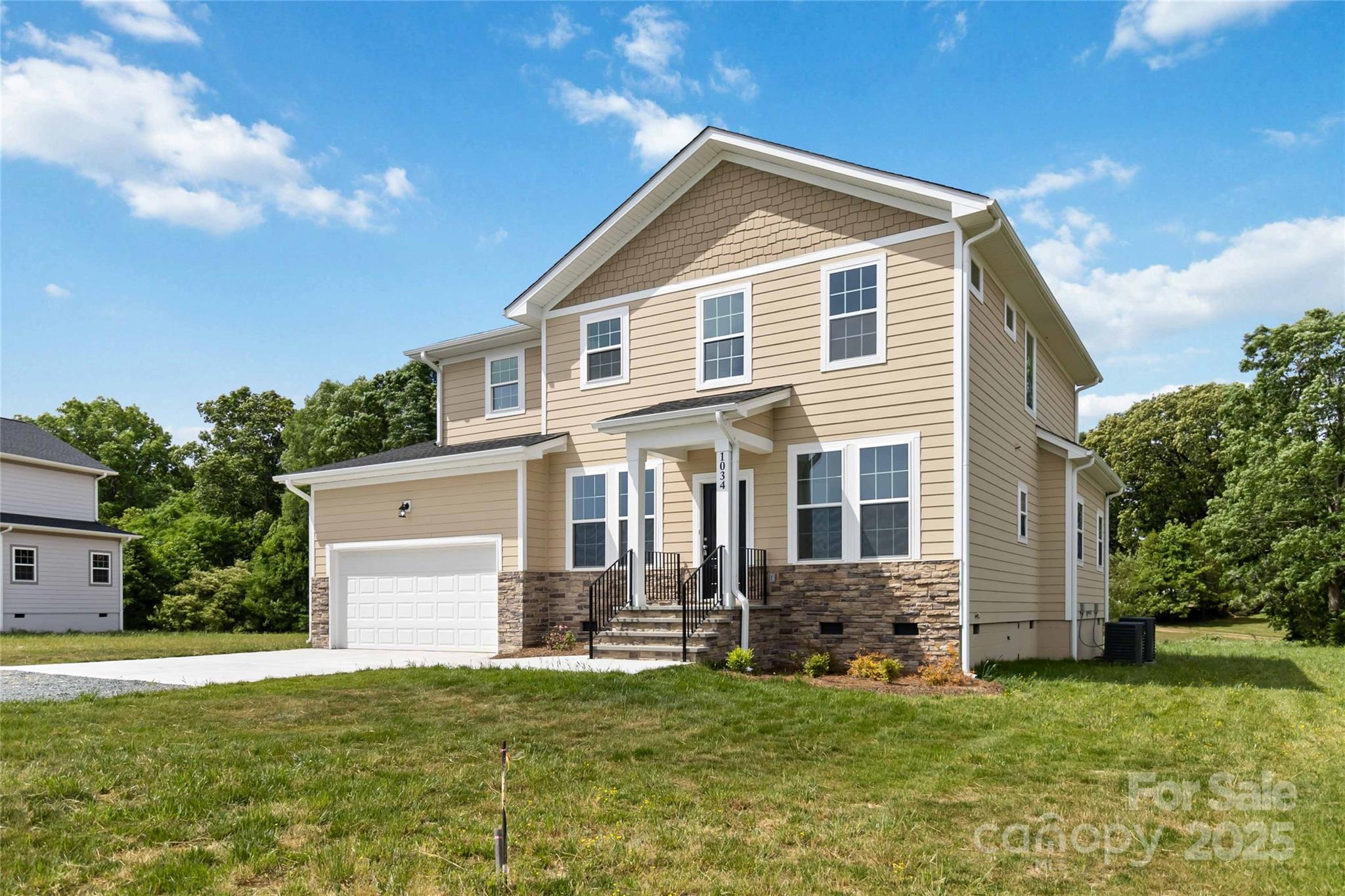 1034 Heath Helms Road Monroe, NC 28110 - Photo 2 of 30 a front view of a house with a garden
