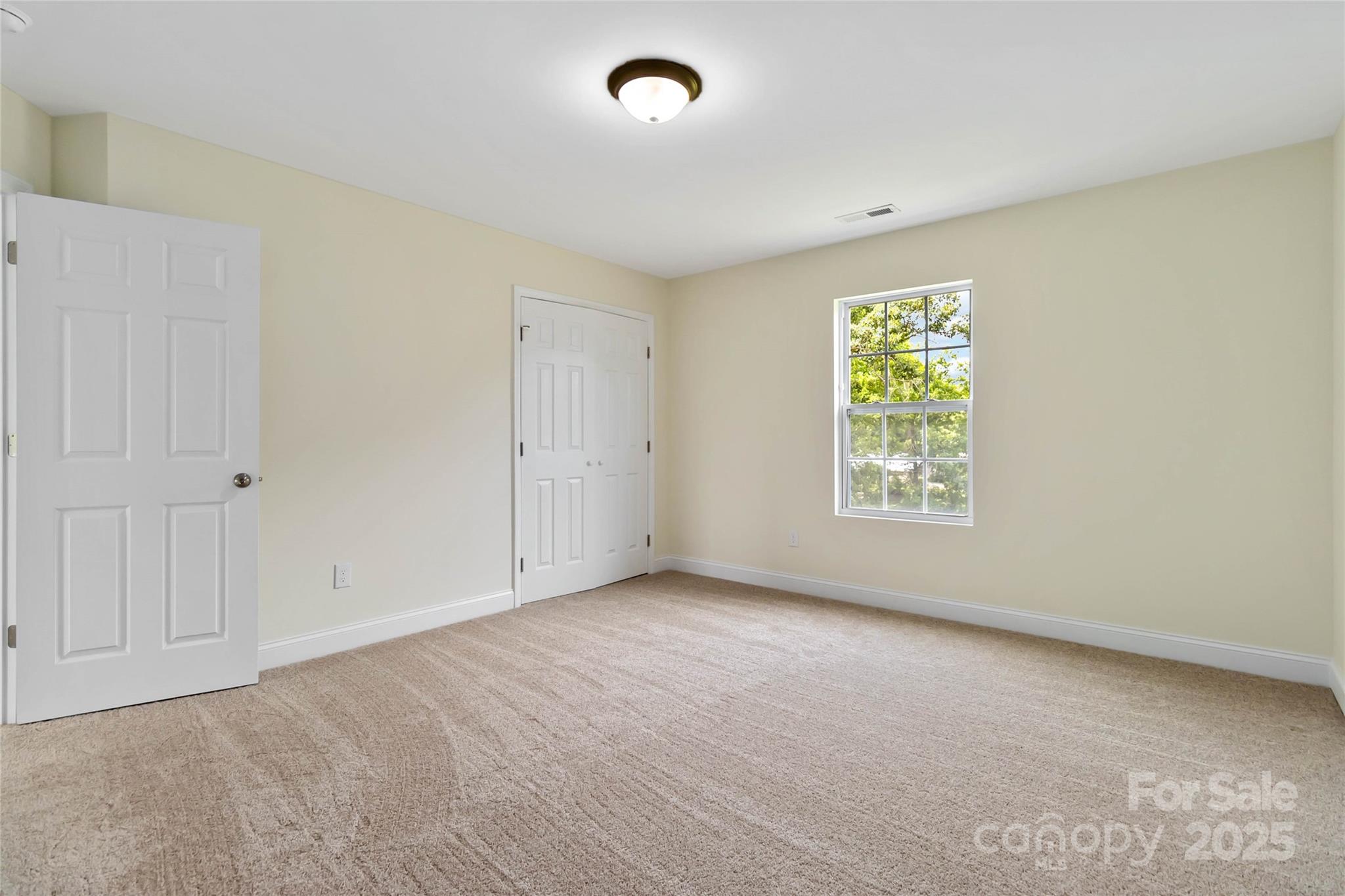 1034 Heath Helms Road Monroe, NC 28110 - Photo 21 of 30 an empty room with windows and closet