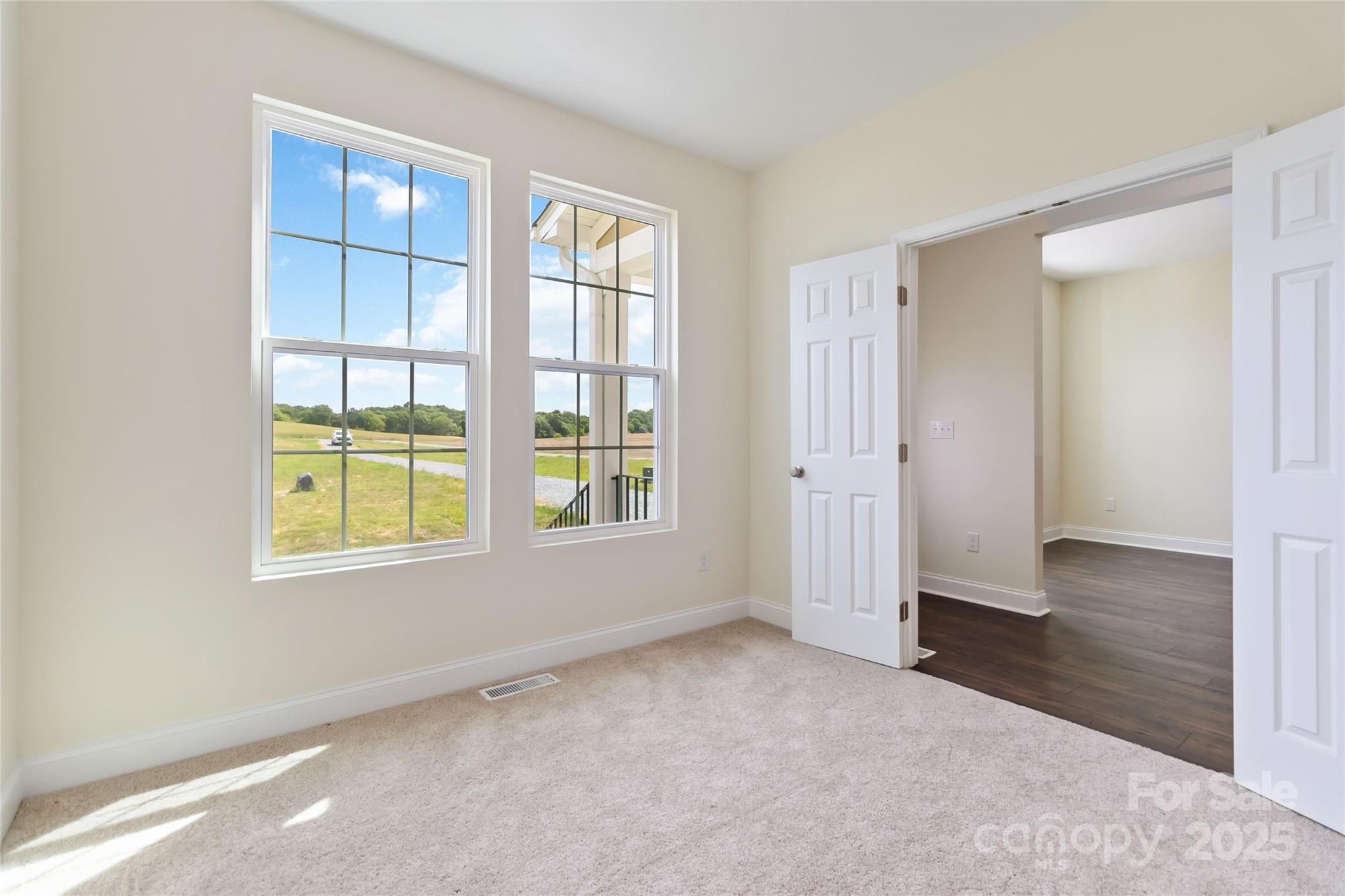 1034 Heath Helms Road Monroe, NC 28110 - Photo 5 of 30 an empty room with windows