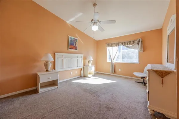 a view of a livingroom with a window and furniture
