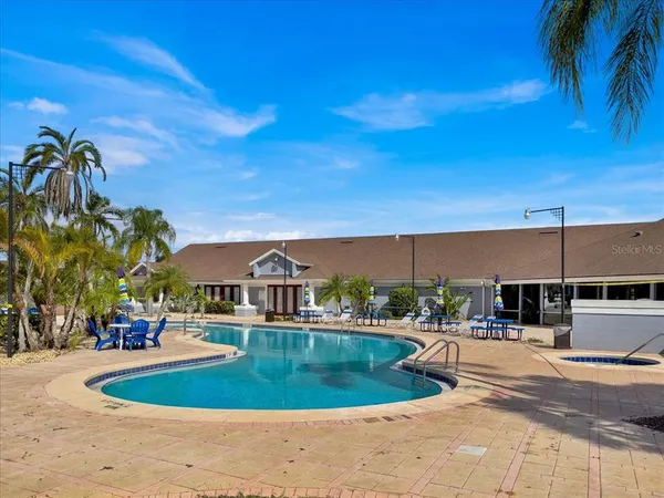a view of a swimming pool with a patio