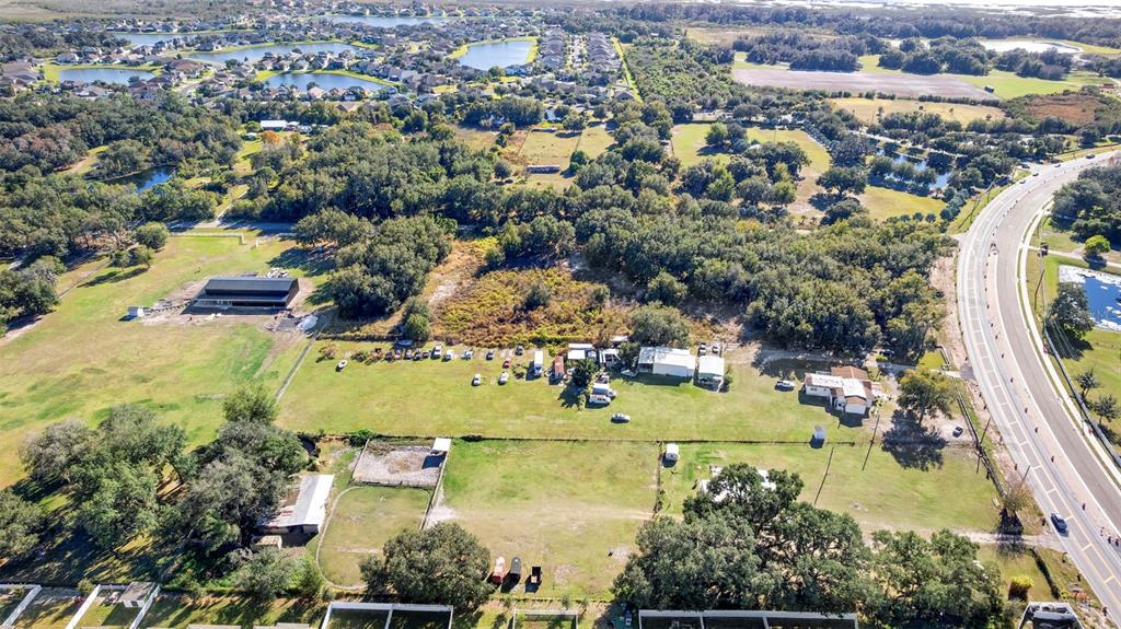4320 Boggy Creek Road Kissimmee, FL 34744 - Photo 19 of 24 an aerial view of residential houses with outdoor space