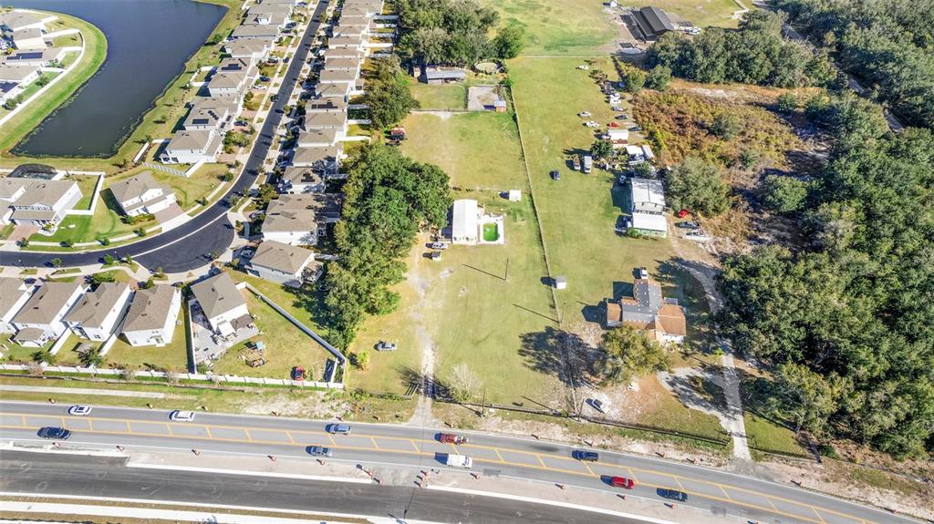 4320 Boggy Creek Road Kissimmee, FL 34744 - Photo 24 of 24 an aerial view of a residential apartment building with a yard and parking space