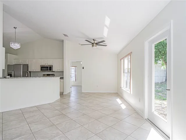 a view of a kitchen with a sink and a window