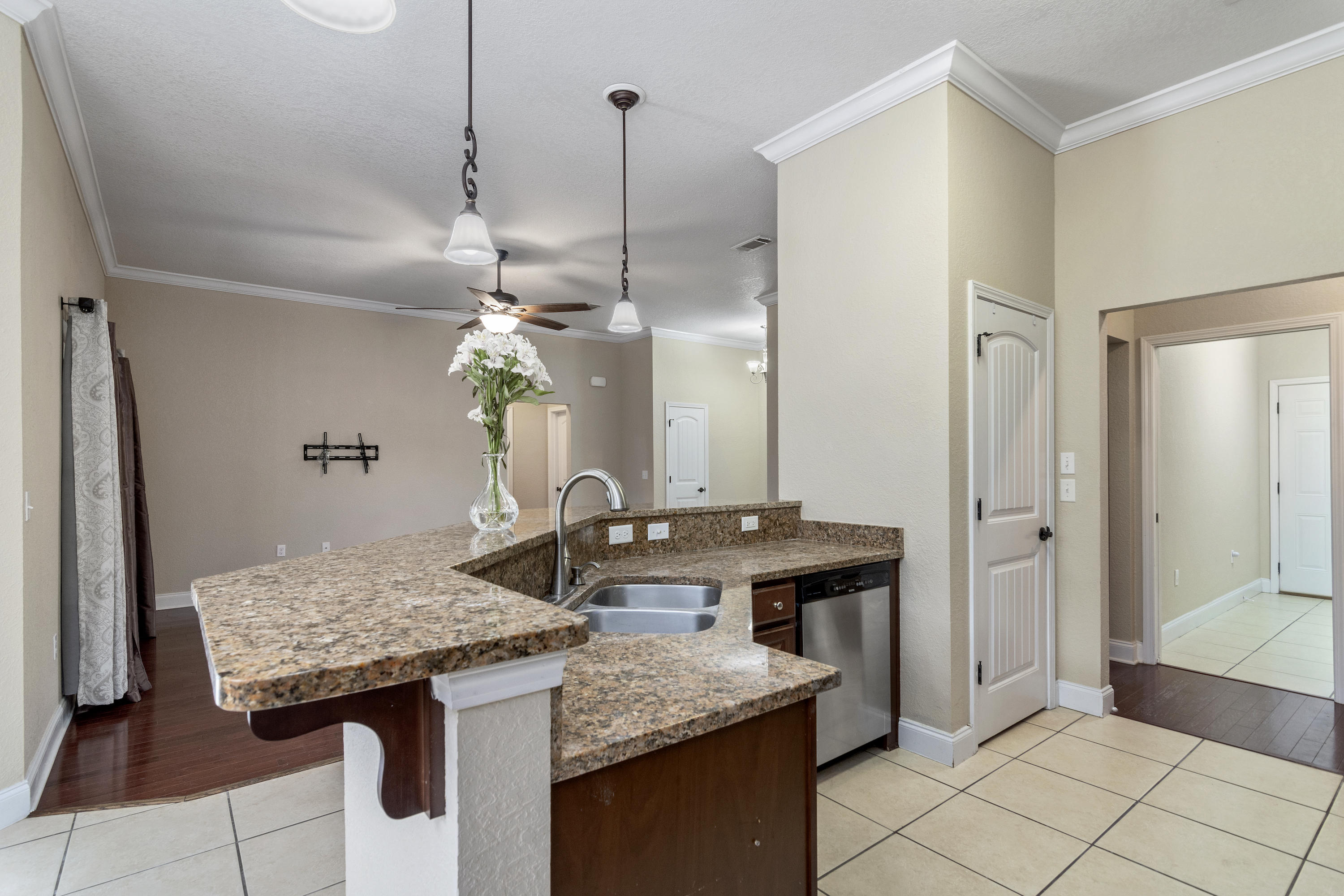 4610 Hermosa Road Crestview, FL 32539 - Photo 11 of 35 a bathroom with a granite countertop sink and a mirror