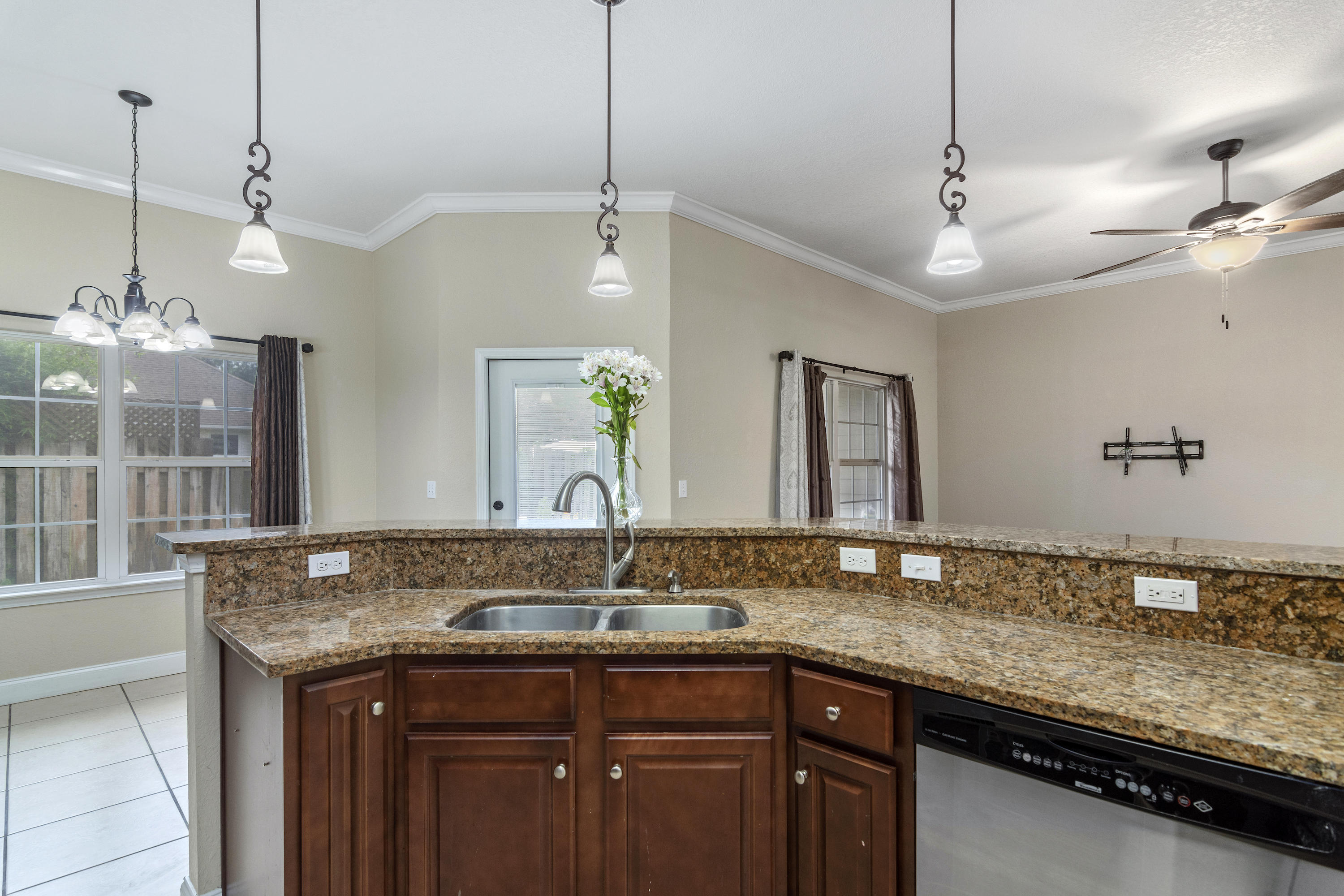 4610 Hermosa Road Crestview, FL 32539 - Photo 13 of 35 a bathroom with a granite countertop sink and a mirror