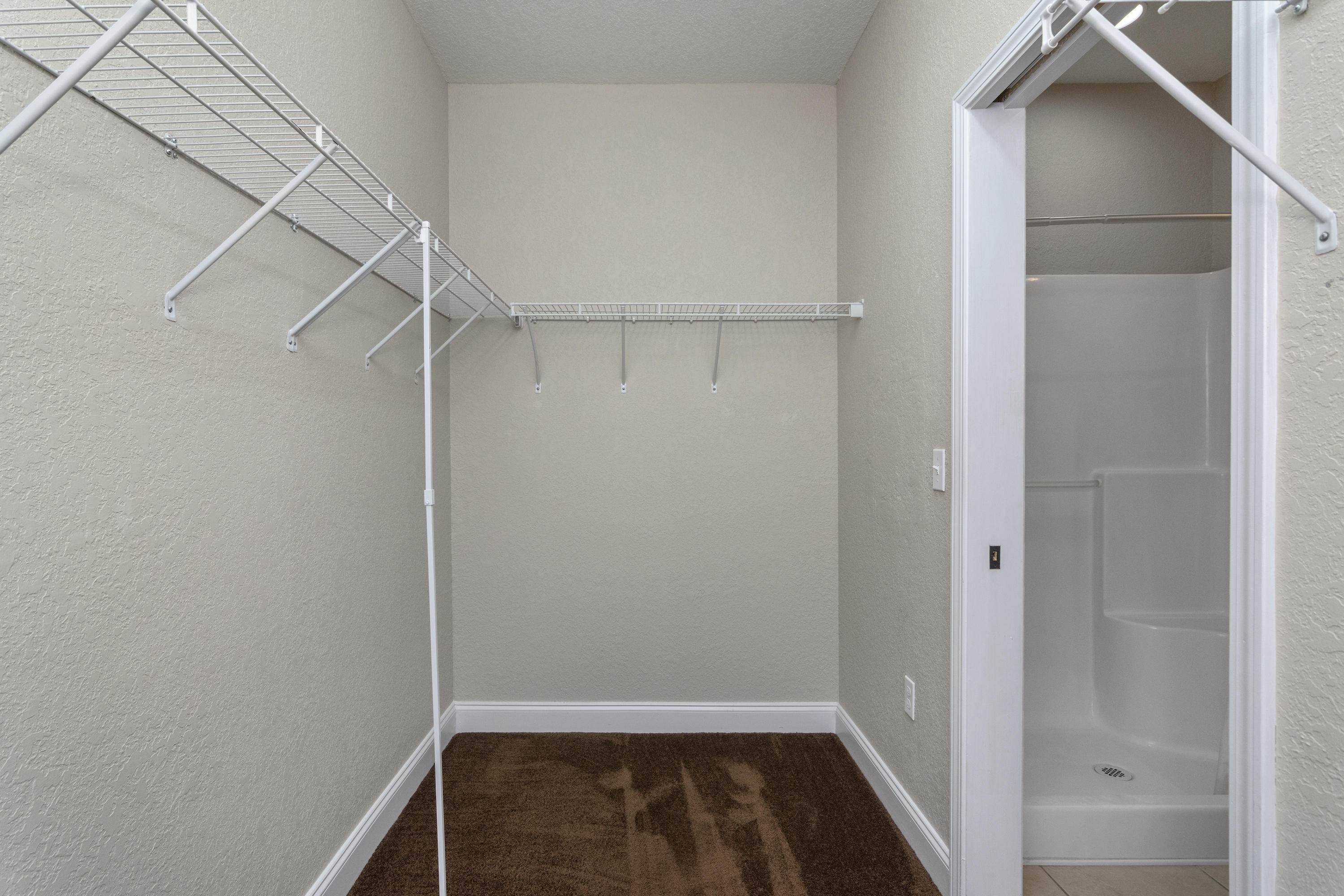 4610 Hermosa Road Crestview, FL 32539 - Photo 19 of 35 a view of walk in closet with empty racks