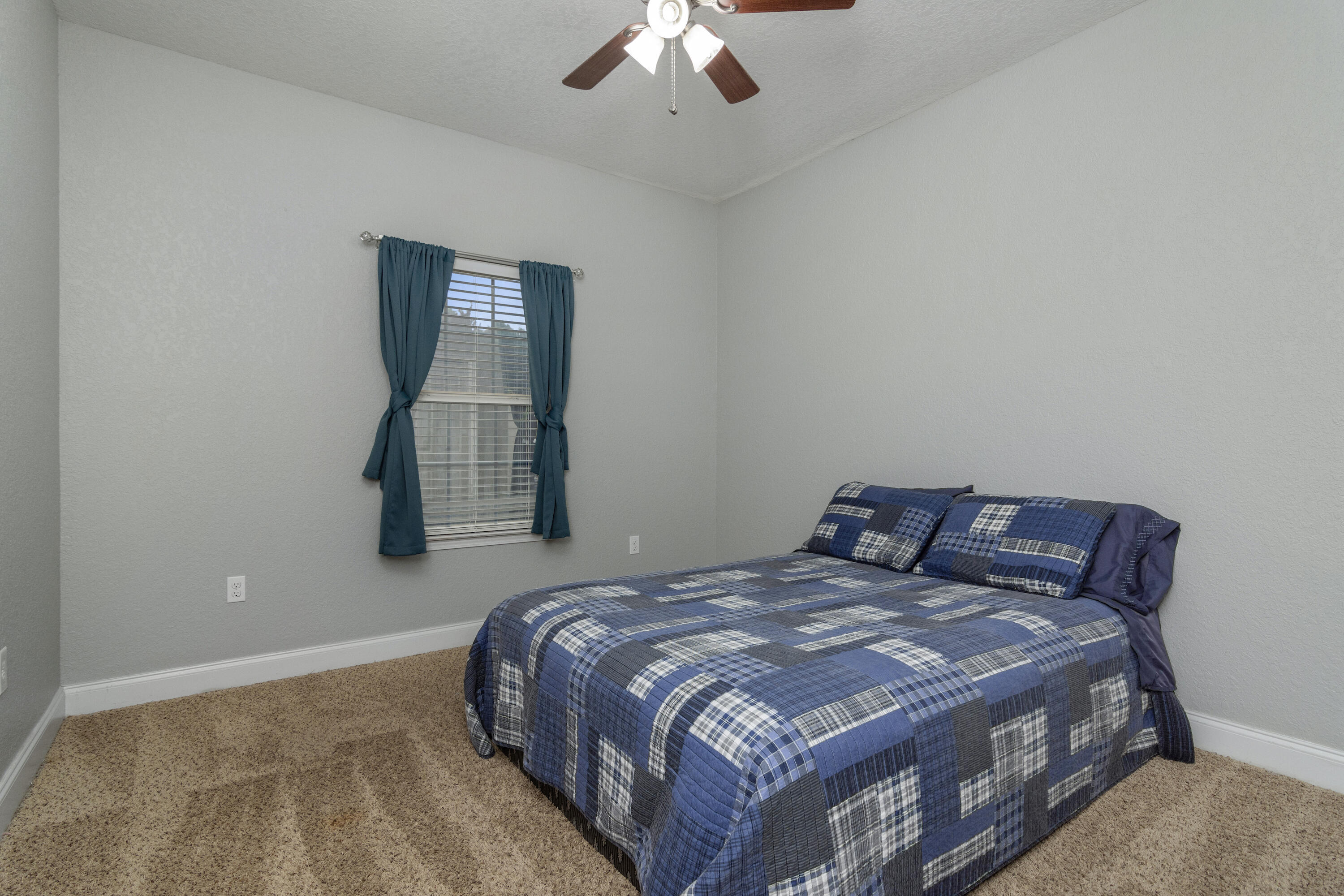 4610 Hermosa Road Crestview, FL 32539 - Photo 20 of 35 a bedroom with a bed and a window
