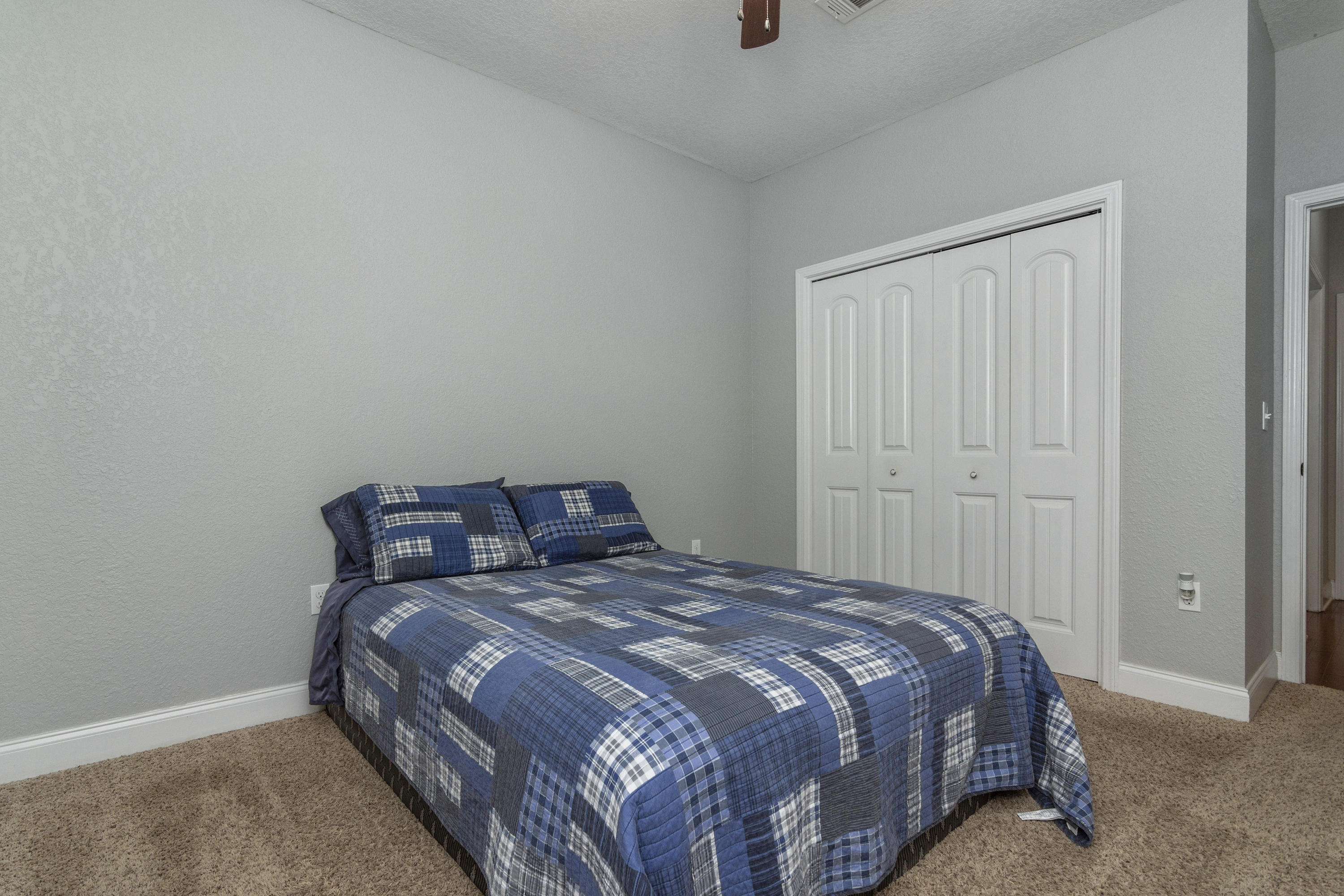 4610 Hermosa Road Crestview, FL 32539 - Photo 21 of 35 a bedroom with a bed and a window