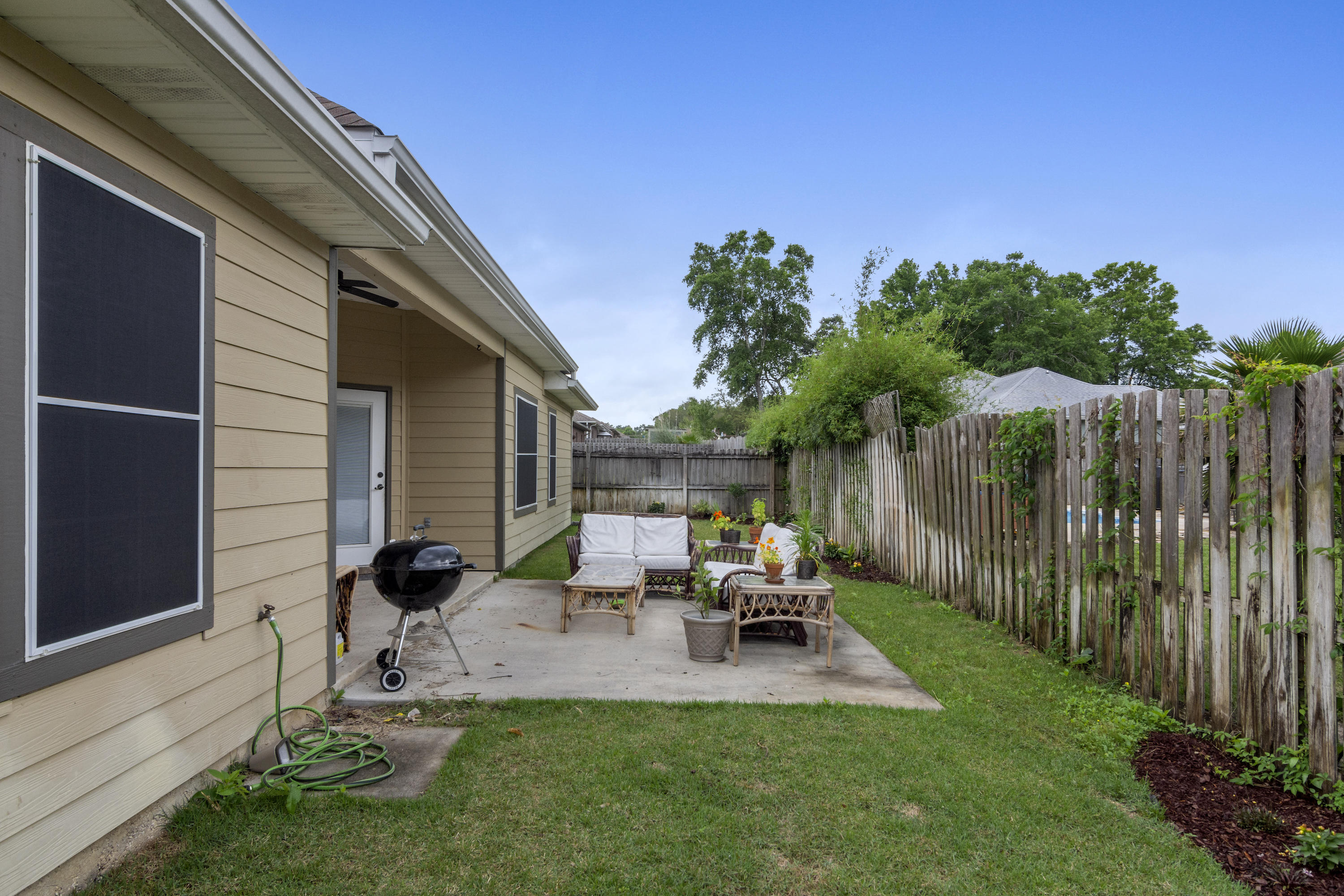 4610 Hermosa Road Crestview, FL 32539 - Photo 33 of 35 a view of backyard of house with seating space