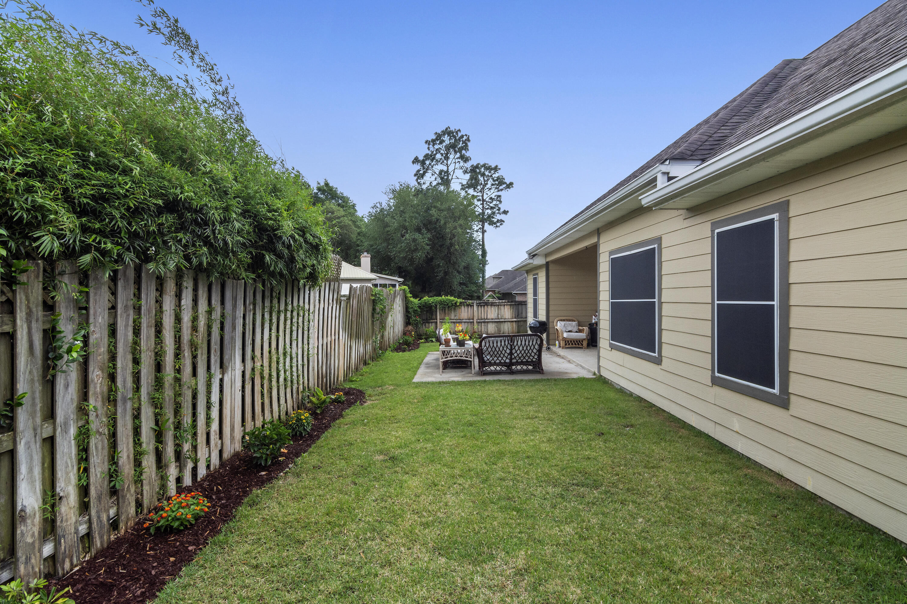 4610 Hermosa Road Crestview, FL 32539 - Photo 35 of 35 a view of a house with backyard and porch