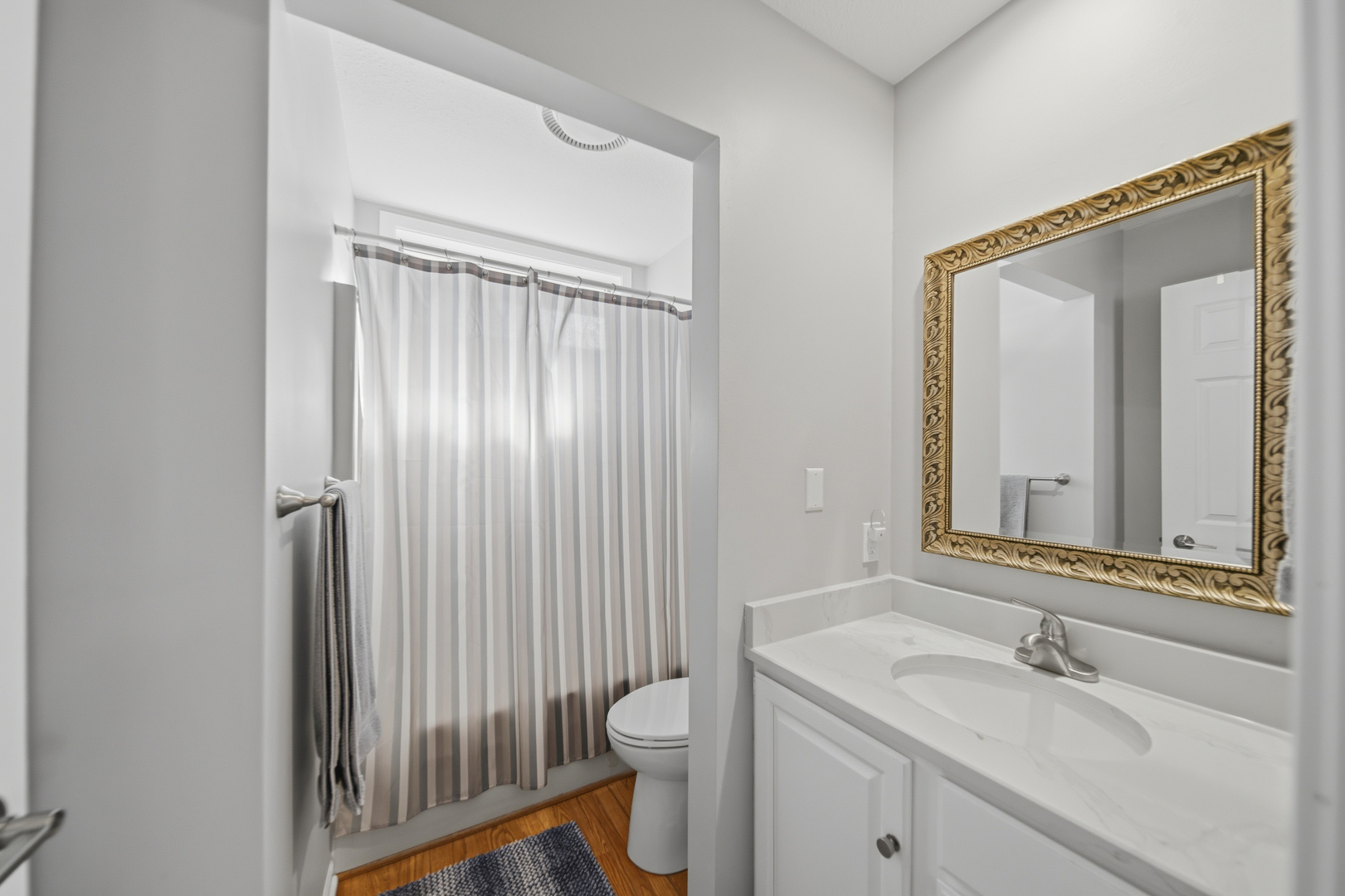 1101 Northridge Dixon, IL 61021 - Photo 24 of 45 a bathroom with a sink a toilet and a mirror