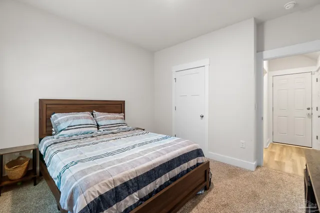 a bedroom with a bed and a view of bedroom