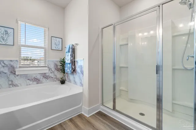 a bathroom with a bathtub and a shower