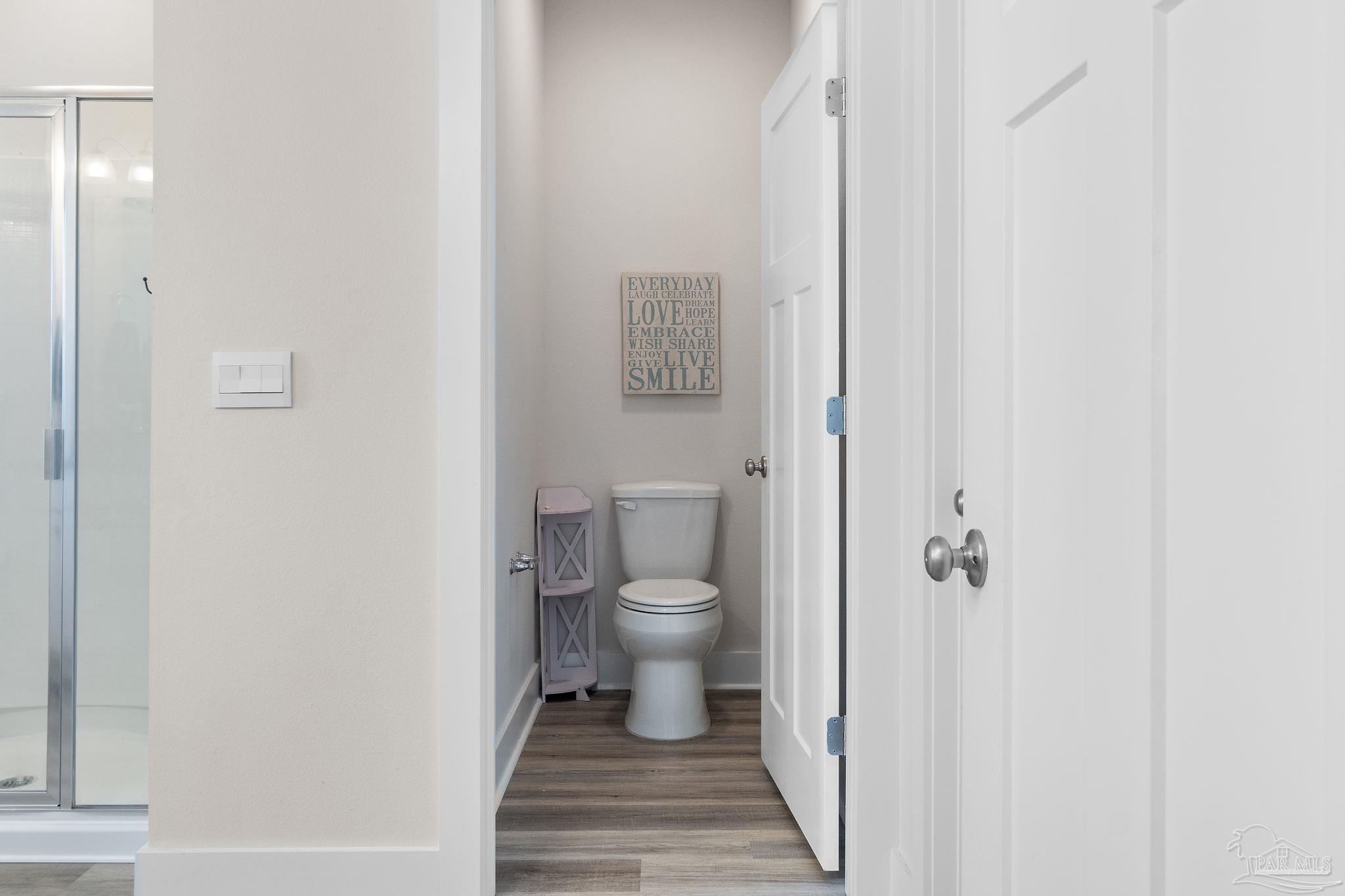 6060 Rutherford Loop Pensacola, FL 32526 - Photo 25 of 30 a bathroom with a toilet and a shower