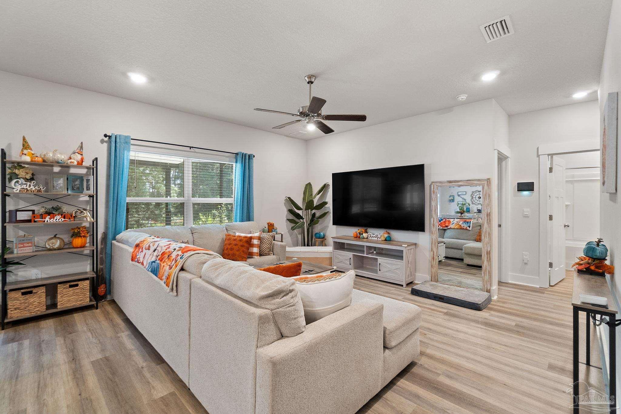6060 Rutherford Loop Pensacola, FL 32526 - Photo 9 of 30 a living room with furniture and a flat screen tv