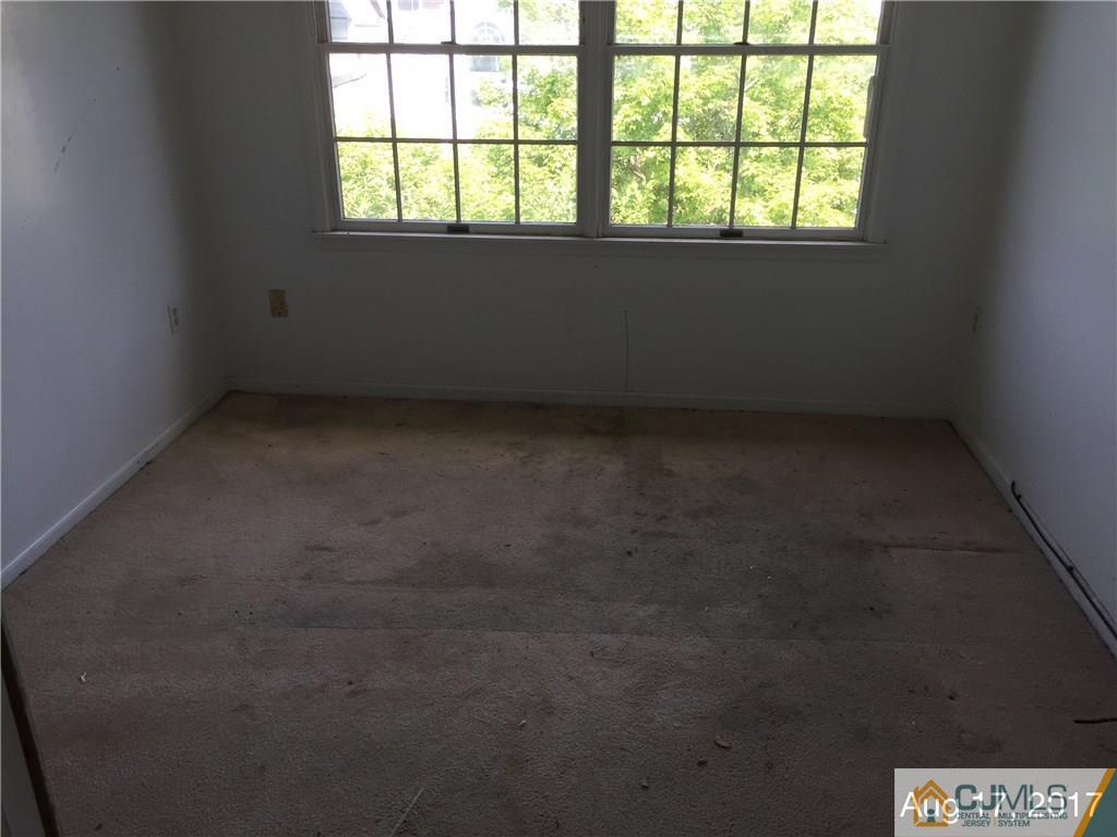 337 Edpas Road, Unit 337 New Brunswick, NJ 08901 - Photo 8 of 11 an empty room with a window