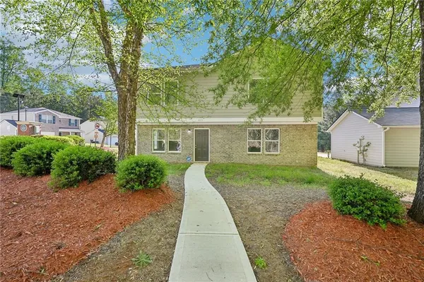 front view of a house with a yard